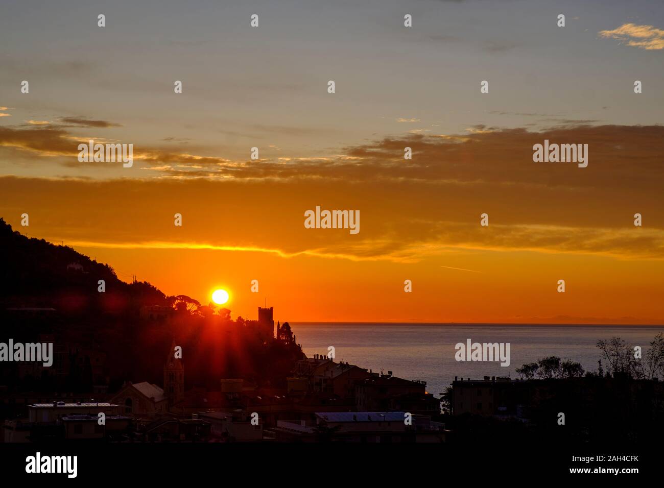 Italy, Liguria, Riviera di Ponente, Finale Ligure, Town and sea at sunrise Stock Photo