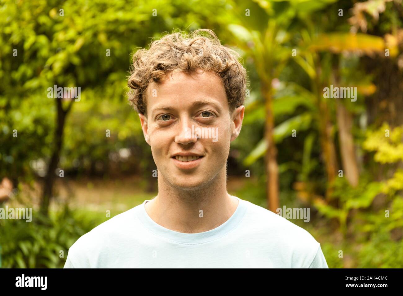 Portrait of smiling young strawberry blonde man Stock Photo