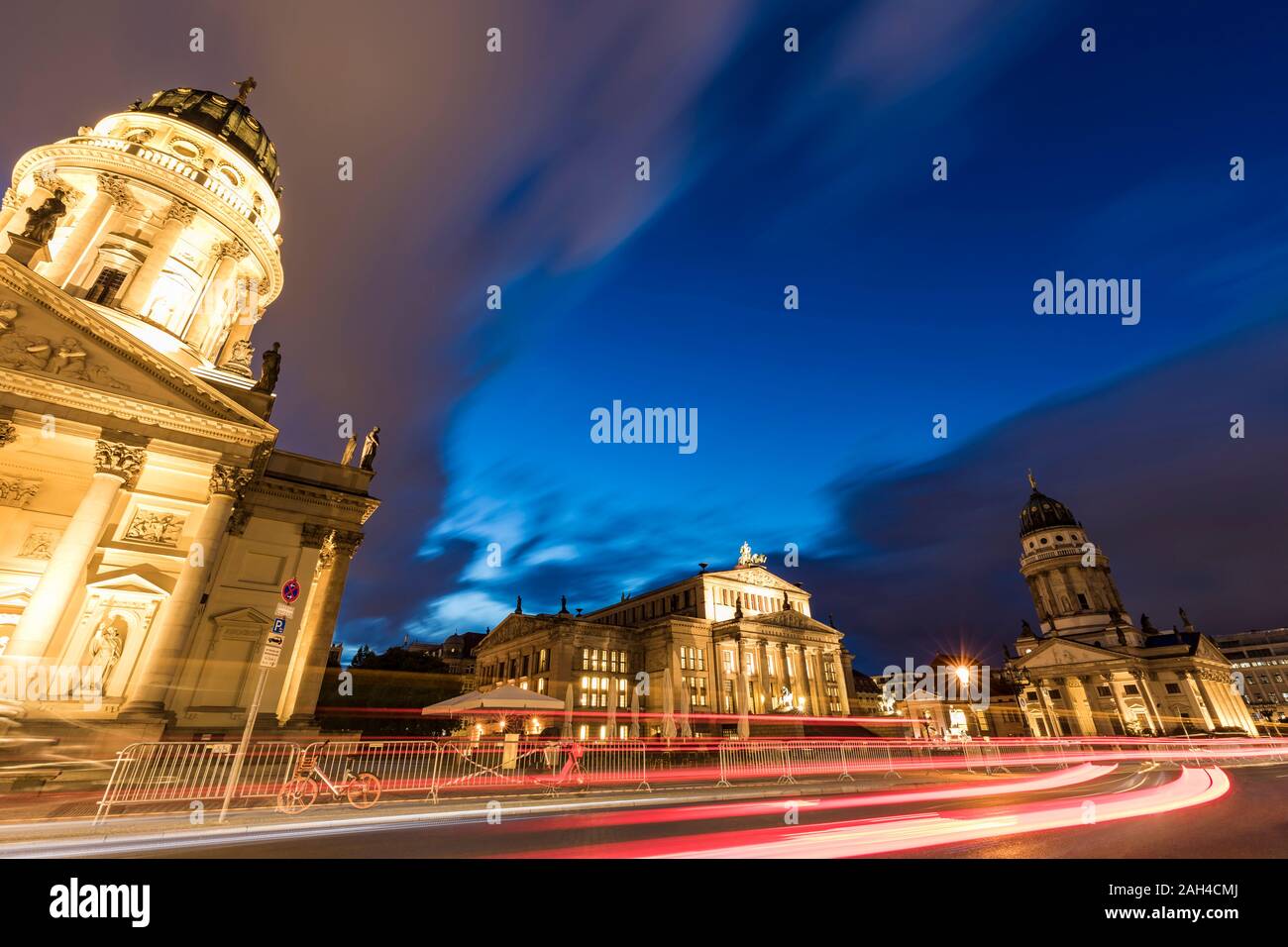 Germany, Berlin, Gendarmenmarkt, Mitte, German Cathedral, Konzerthaus and French Cathedral illuminated at dusk Stock Photo