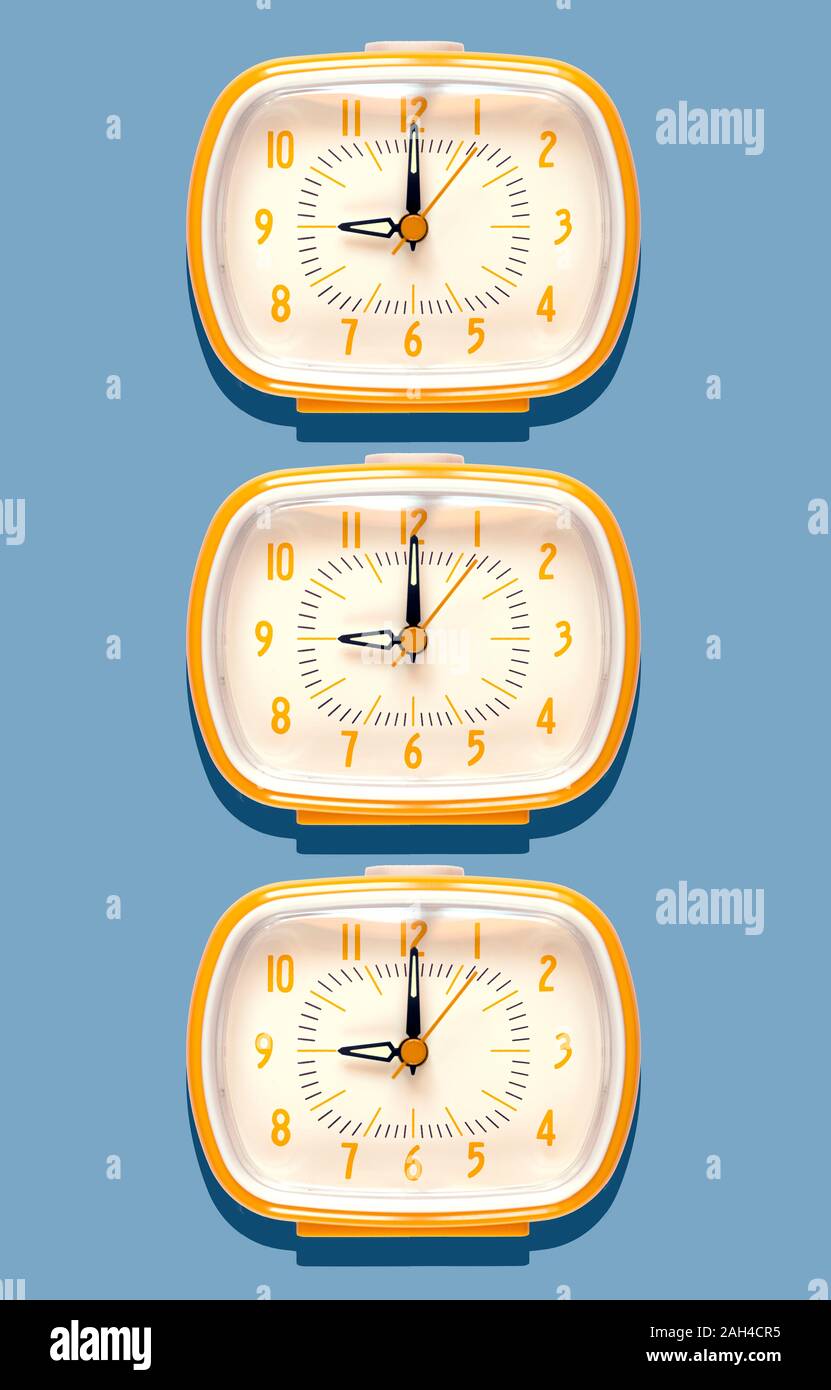 3D Illustration, yellow alarm clocks at nine o'clock on blue background Stock Photo