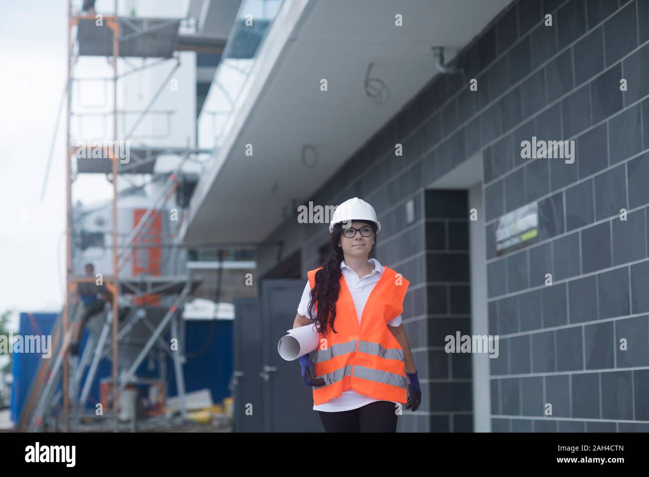 Female construction engineer checking the construction of a new house Stock Photo