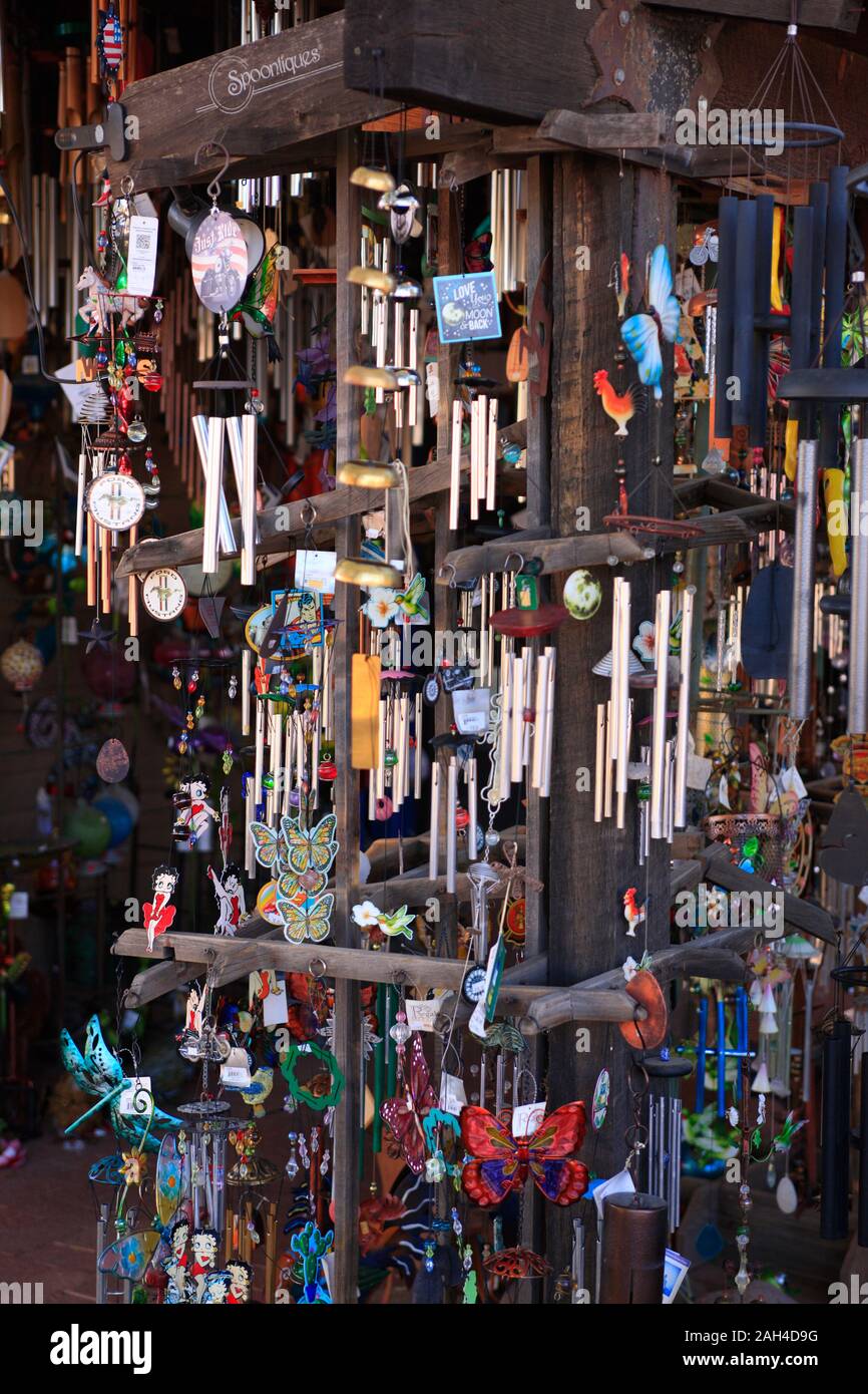 Selection of wind chimes for sale outside a store in Tubac, AZ Stock Photo