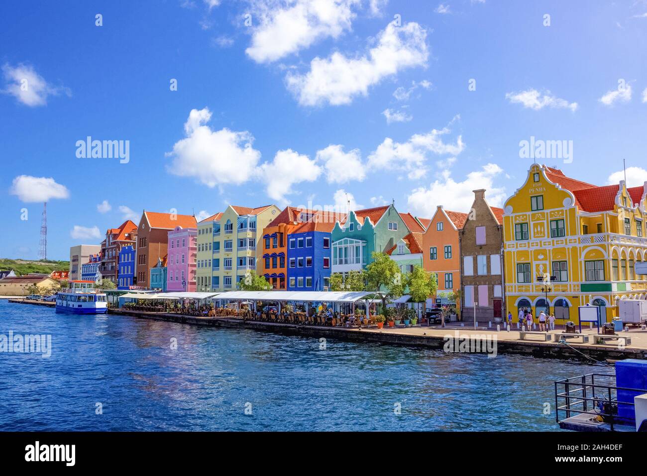 Specific coloured buildings at street in Curacao Stock Photo - Alamy