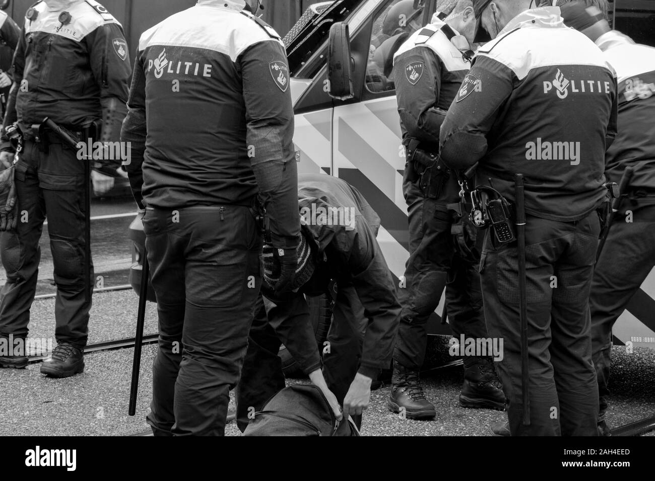 Police Arresting Protesters At The Rebellion Extinction Demonstration Amsterdam The Netherlands 2019 In Black And White Stock Photo