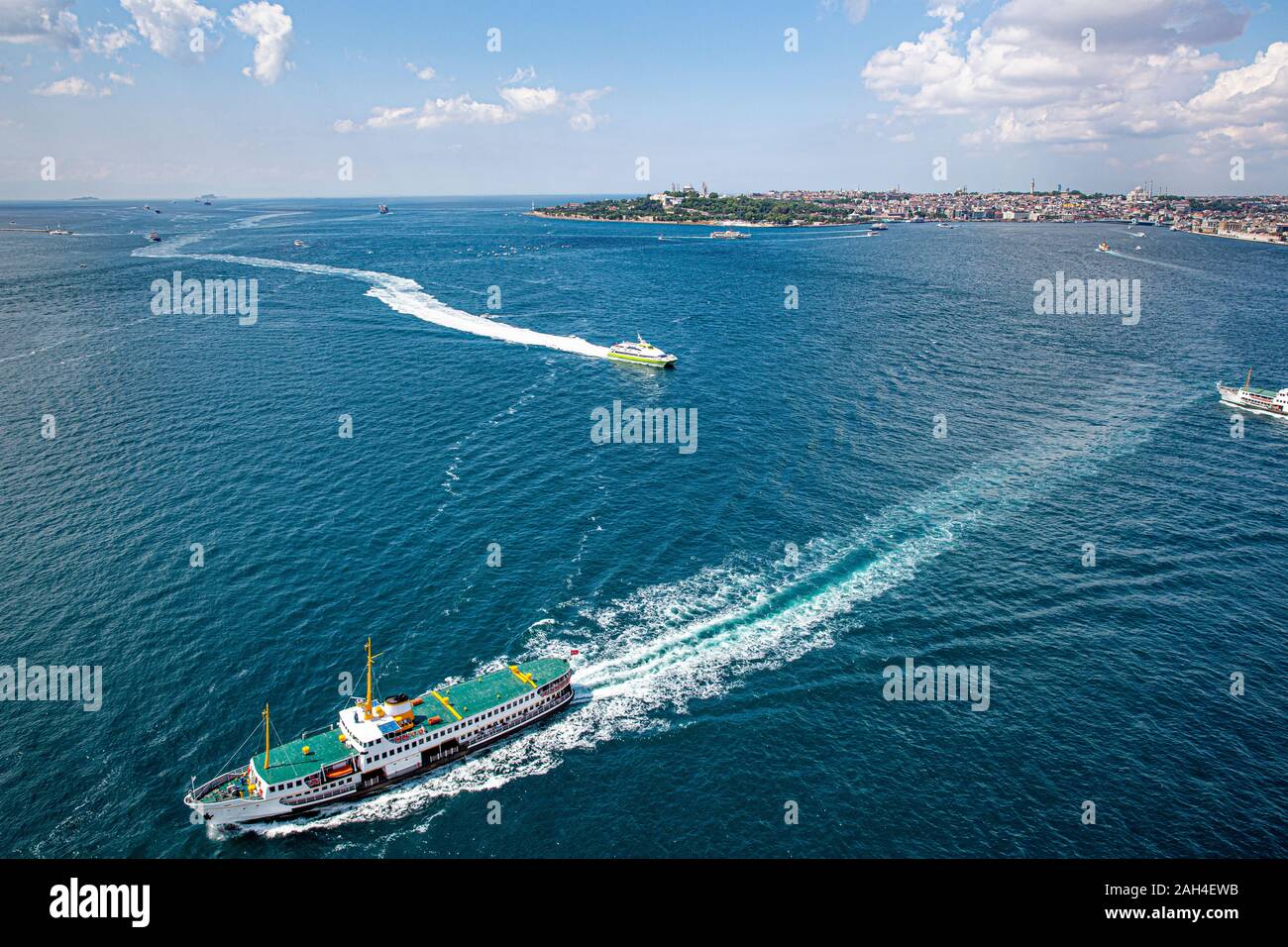 Istanbul, Turkey - June 9, 2013; Istanbul landscape from helicopter. View of City lines ferry (Sehir Hatlari Vapuru) transporting passengers in Istanb Stock Photo