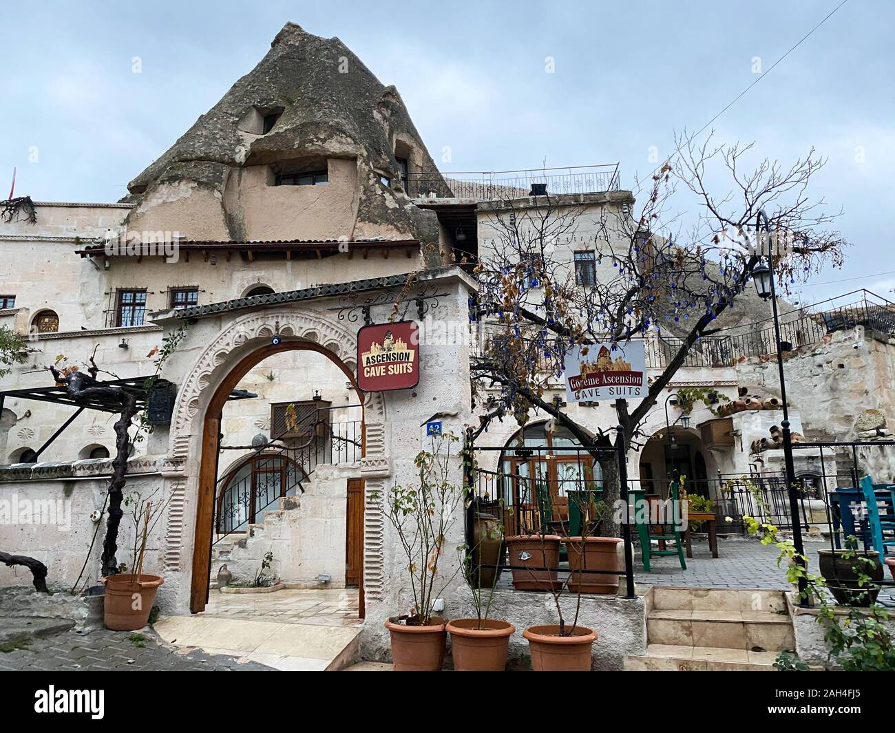 An old building inside a cliff with an arch. Caption: Ascension Cave Costumes. Cappadocia Turkey November 5, 2019. Interesting. Stock Photo