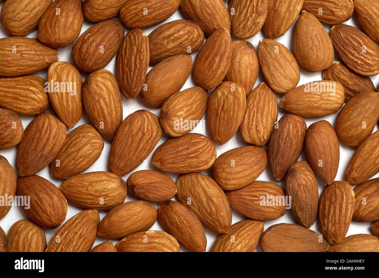 Almond texture closeup. Almond photo background. Organic food rustic banner  template. Tasty healthy snack. Scattered nut on table. Almond nut top view  Stock Photo - Alamy