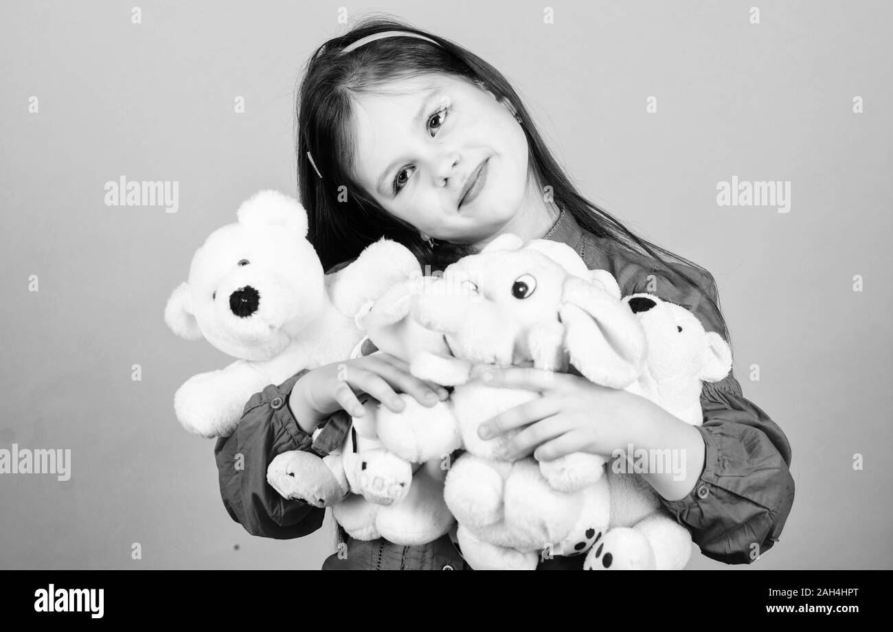 Little girl play with soft toy teddy bear. Sweet childhood. Collecting