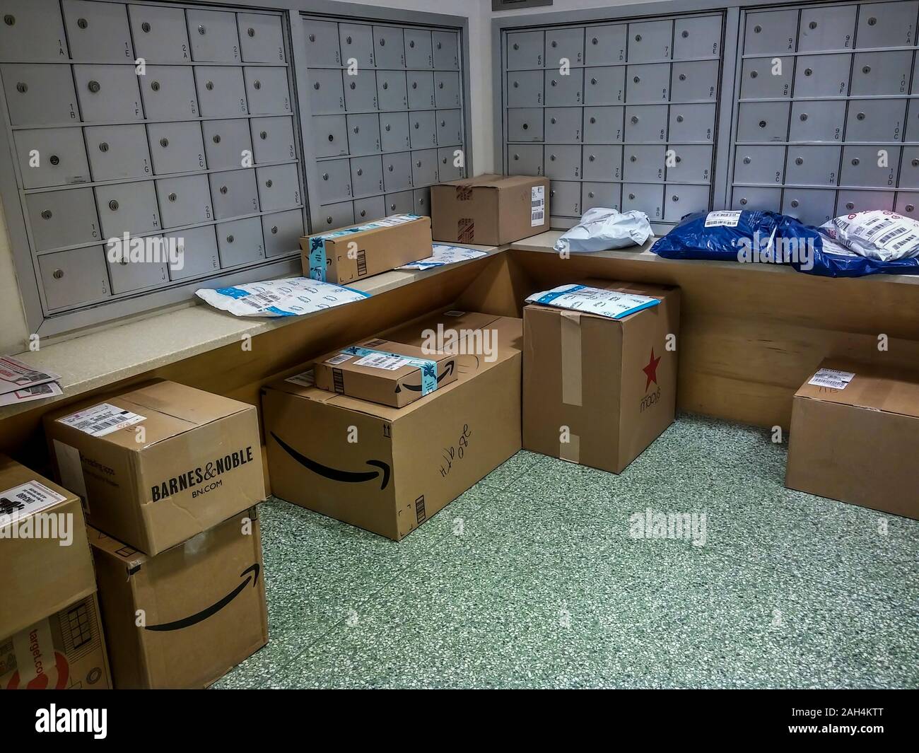 The largesse of online shopping is strewn across the mailbox area in an apartment building in New York on Thursday, December 19, 2019.  (© Richard B. Levine) Stock Photo