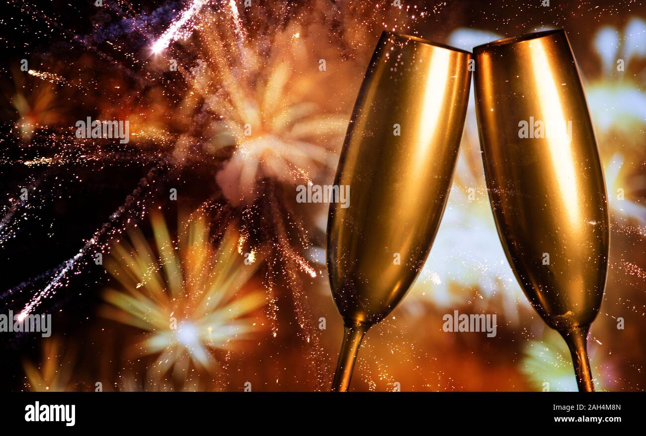 golden champagne glasses and fireworks at new year Stock Photo - Alamy