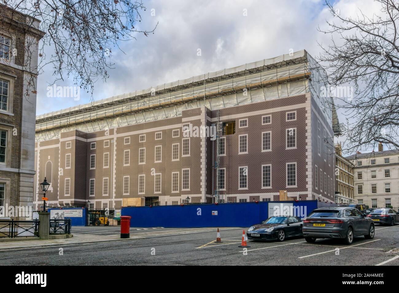Painted hoarding around scaffolding as part of Project Pegasus - the redevelopment of the Inner Temple in the Inns of Court, London. Stock Photo