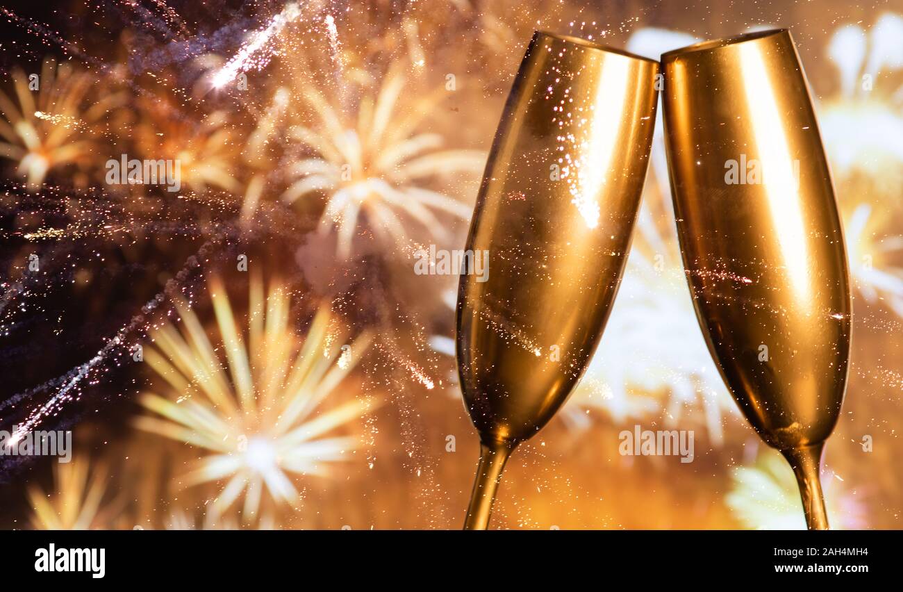 golden champagne glasses and fireworks at new year Stock Photo - Alamy