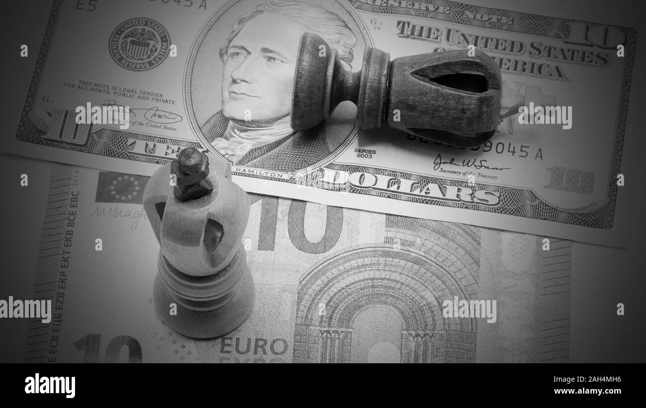 Trade Concept: King Chess Pieces On US Dollar And Euro Banknotes, Isolated On White Background, EU winning, Black And White Stock Photo