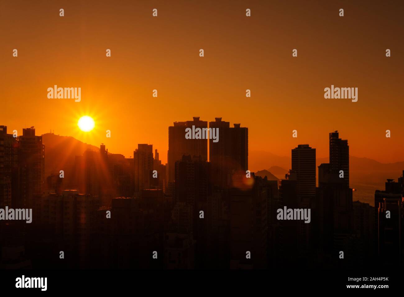 skyscraper city skyline with sunset sky, Hong Kong Stock Photo
