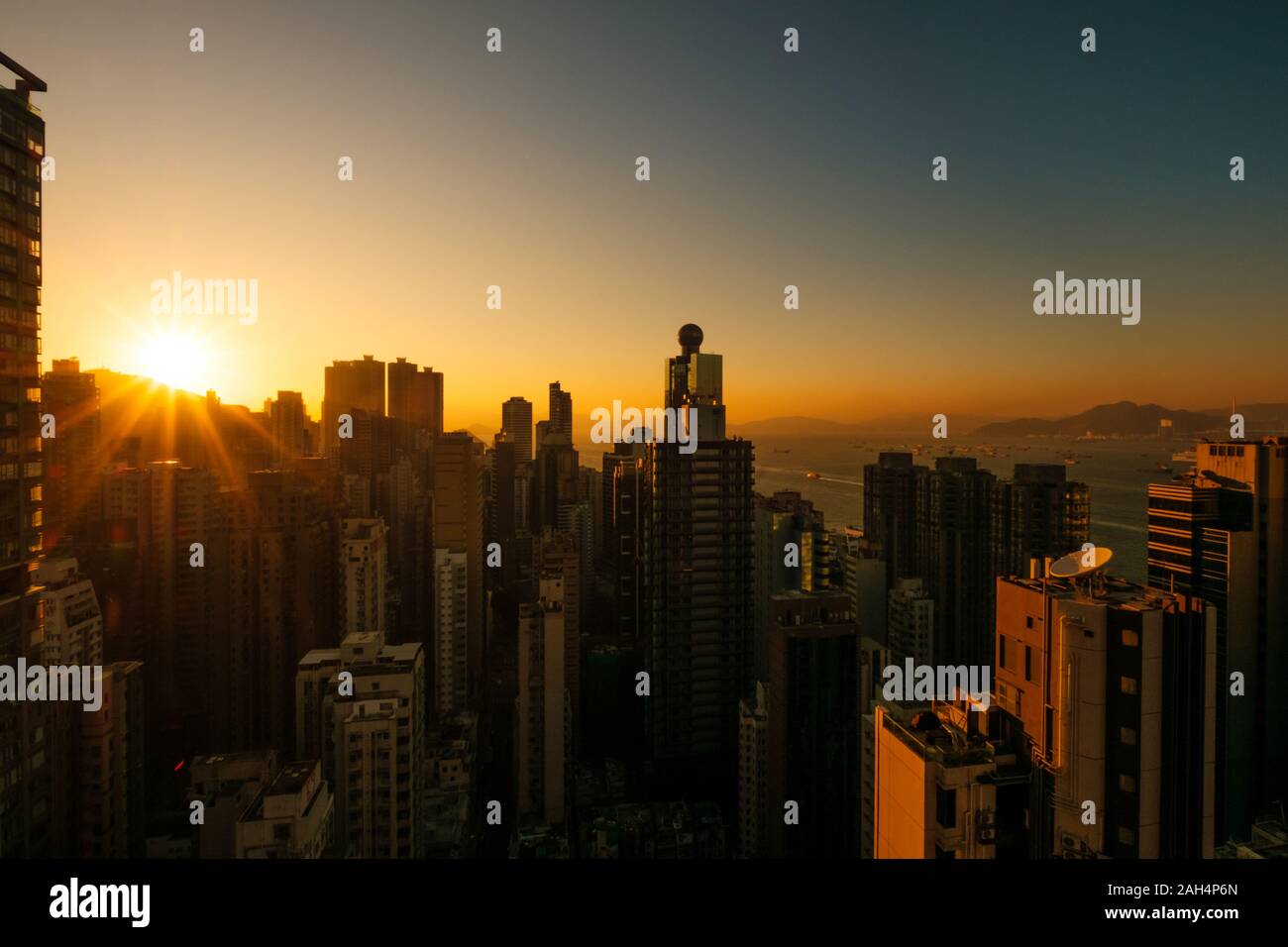 skyscraper city skyline with sunset sky, HongKong Stock Photo