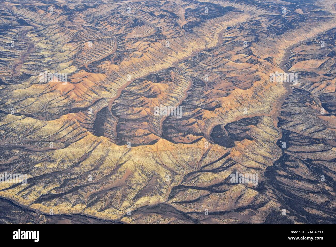 Colorado Rocky Mountains Aerial panoramic views from airplane of abstract Landscapes, peaks, canyons and rural cities in southwest Colorado and Utah. Stock Photo