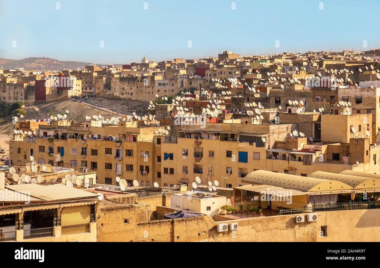Large-scale dish blight in a residential neighborhood of Fez, Morocco, where hundreds of personal satellite dishes sit on rooftops. Stock Photo