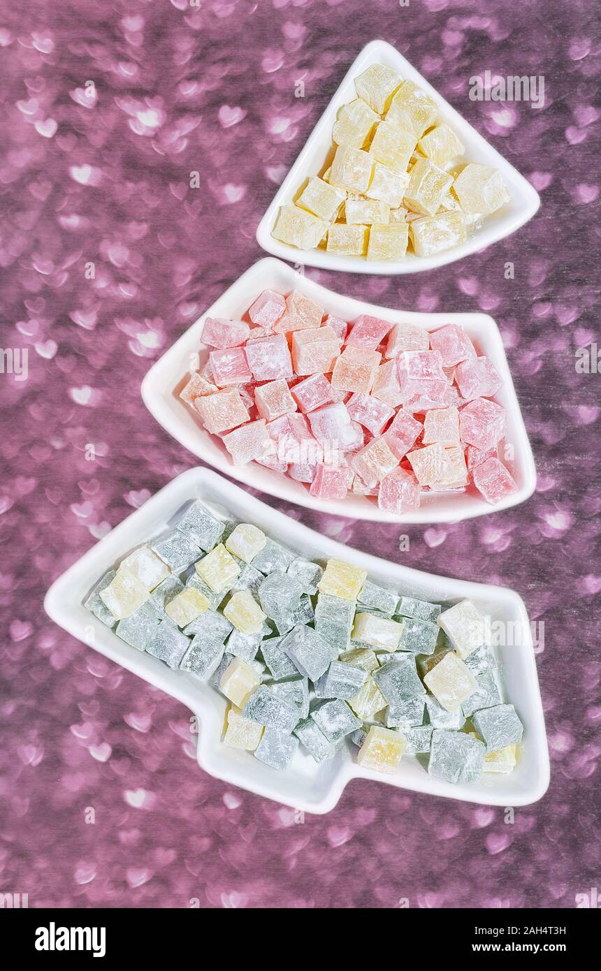 Colorful dessert Turkish delight in a plate in the shape of a Christmas tree. Stock Photo