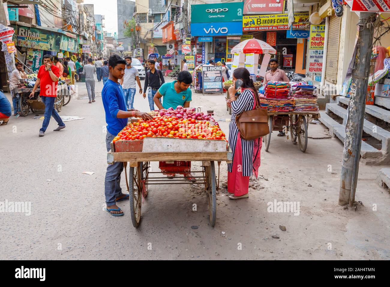 Tomatoes and onions for sale on a roadside barrow Street scene in