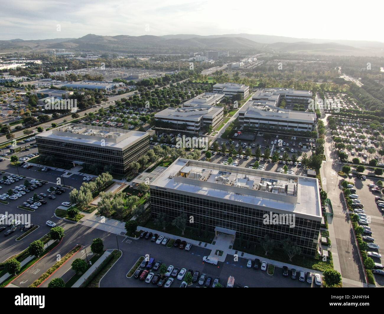 Aerial view of business and finance district with new office building surrounded by parking and road. Irvine Business Complex. Irvine California. USA. December 12th, 2019 Stock Photo
