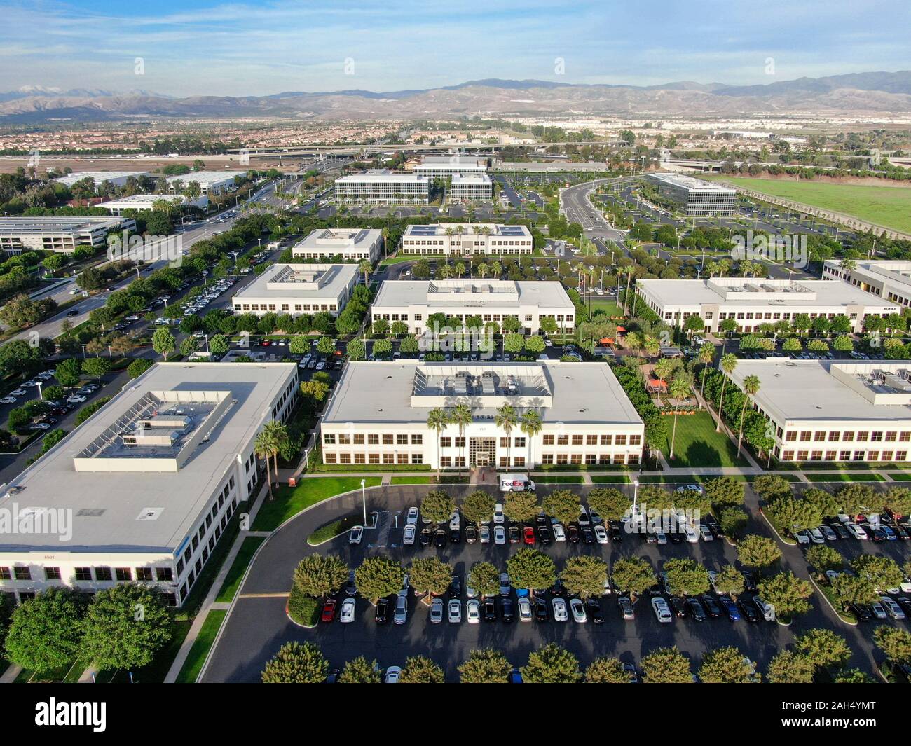 Aerial view of business and finance district with new office building surrounded by parking and road. Irvine Business Complex. Irvine California. USA. December 12th, 2019 Stock Photo