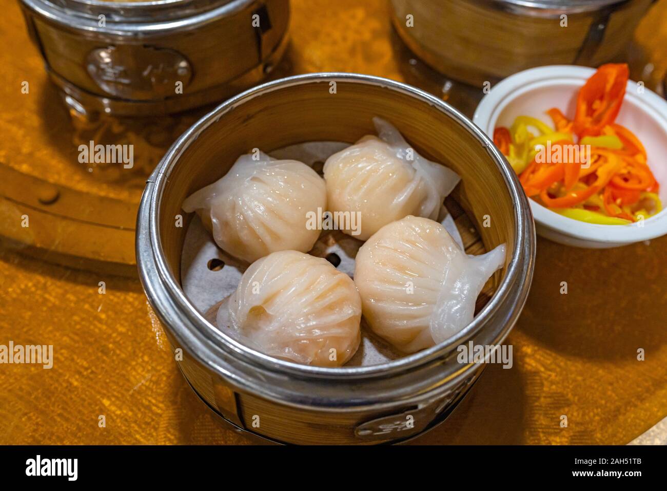 Xia jiao- steamed stuffed shrimp dumplings in dimsum steamer box  Stock Photo
