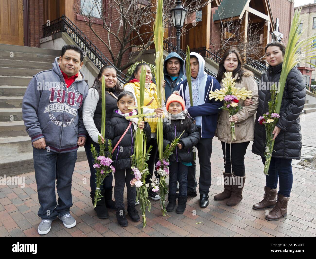Hispanic parishioners pose for portrait on church steps after Palm Sunday service in the Windsor Terrace section of Brooklyn, New York. Stock Photo
