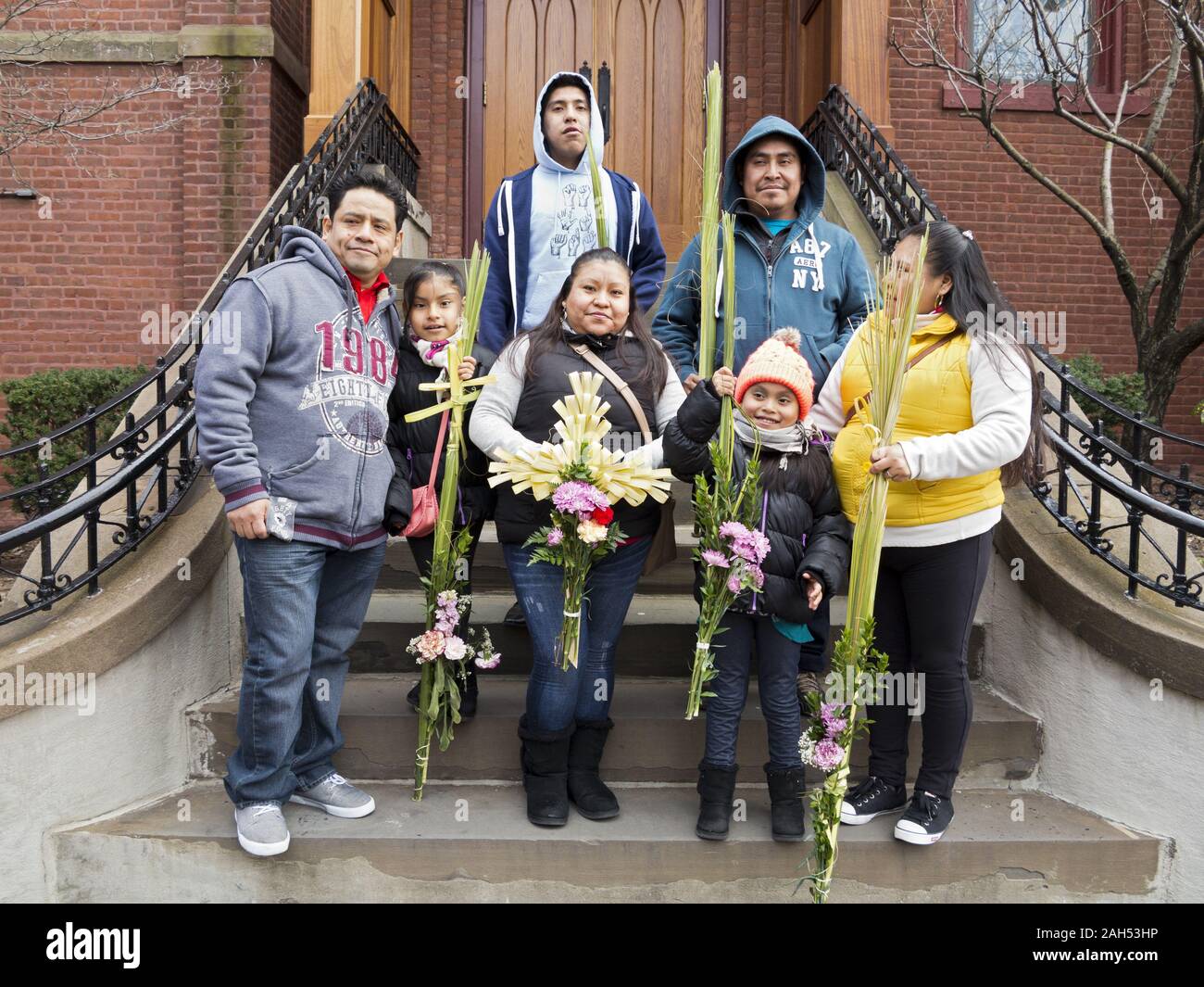Extended Mexican family poses for portrait on church steps after Palm Sunday service in the Windsor Terrace section of Brooklyn, New York. Stock Photo