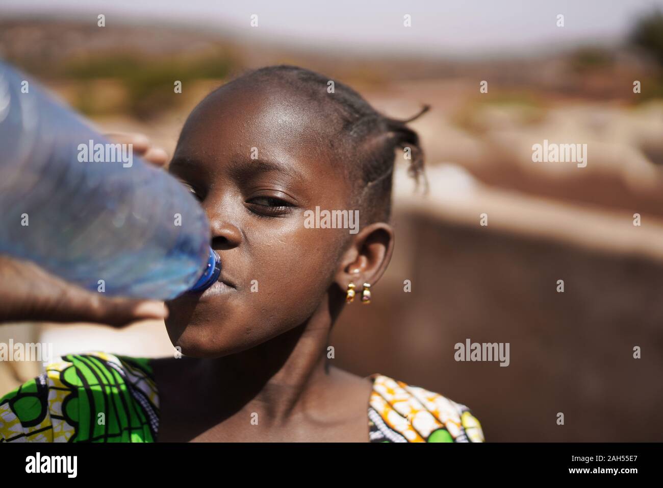 Drinking From A Giant Water Bottle - Stock Photos