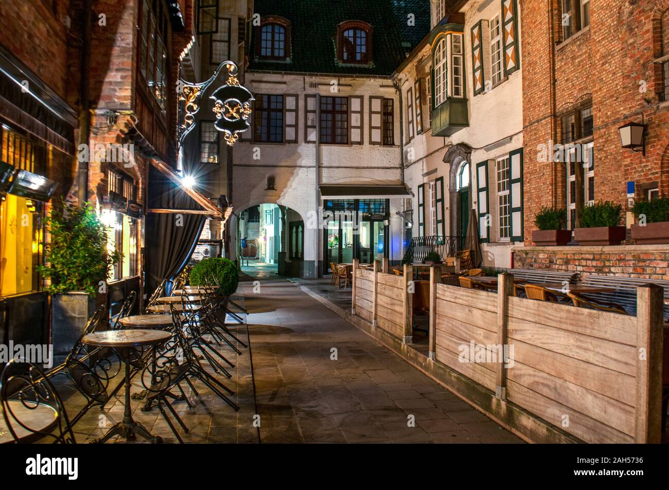 Exterior of a european restaurant in the narrow street at night Stock Photo