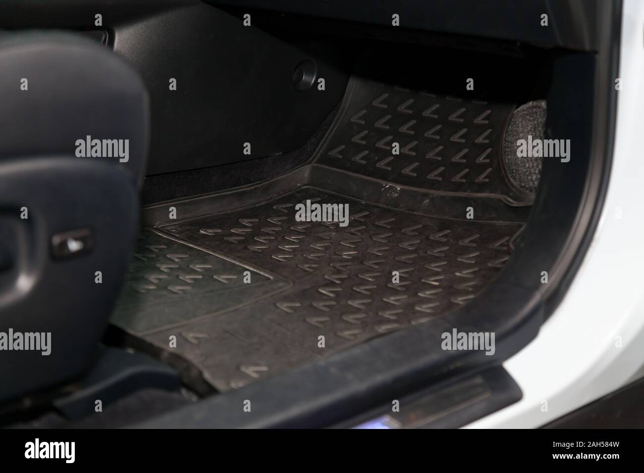 Dirty Car Floor Mats Of Black Rubber Under Passenger Seat In The