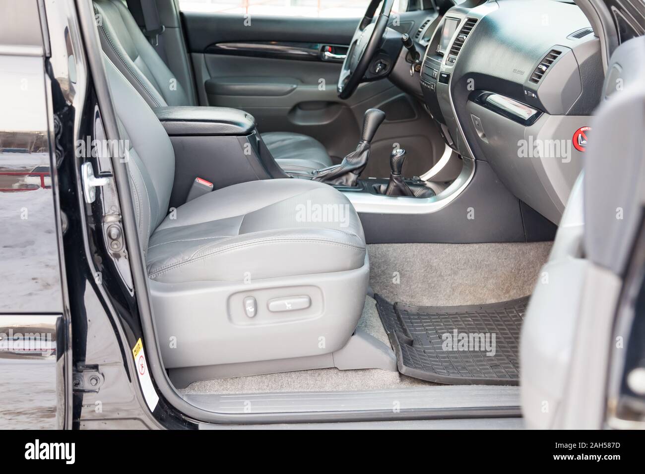 Novosibirsk, Russia - 12.19.2019: View to the gray interior of toyota Land Cruiser prado 120 with dashboard, media system, front seats, steering and s Stock Photo