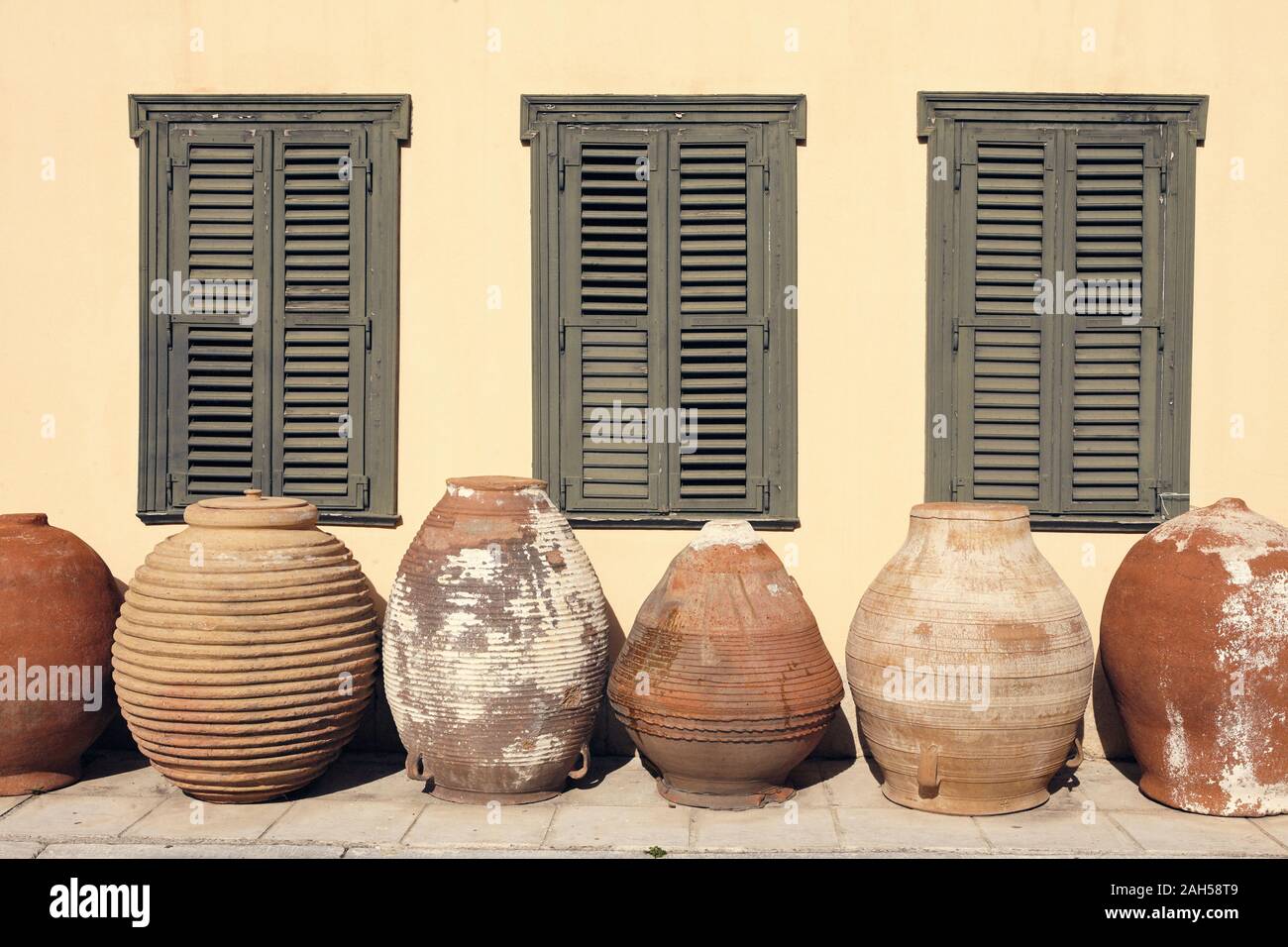 Traditional ceramic vessels in front of the building of Psaropoulos Museum of Traditional Pottery in Athens Stock Photo
