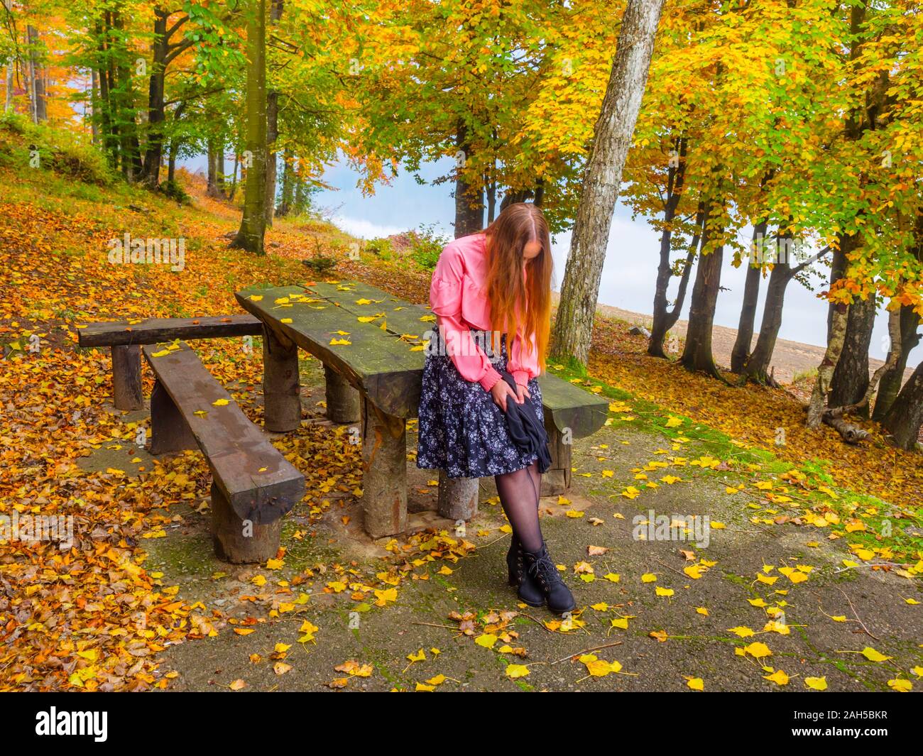 Country-girl countrygirl in countryside near lake river sad waiting for somebody looking down hiding identity face Stock Photo