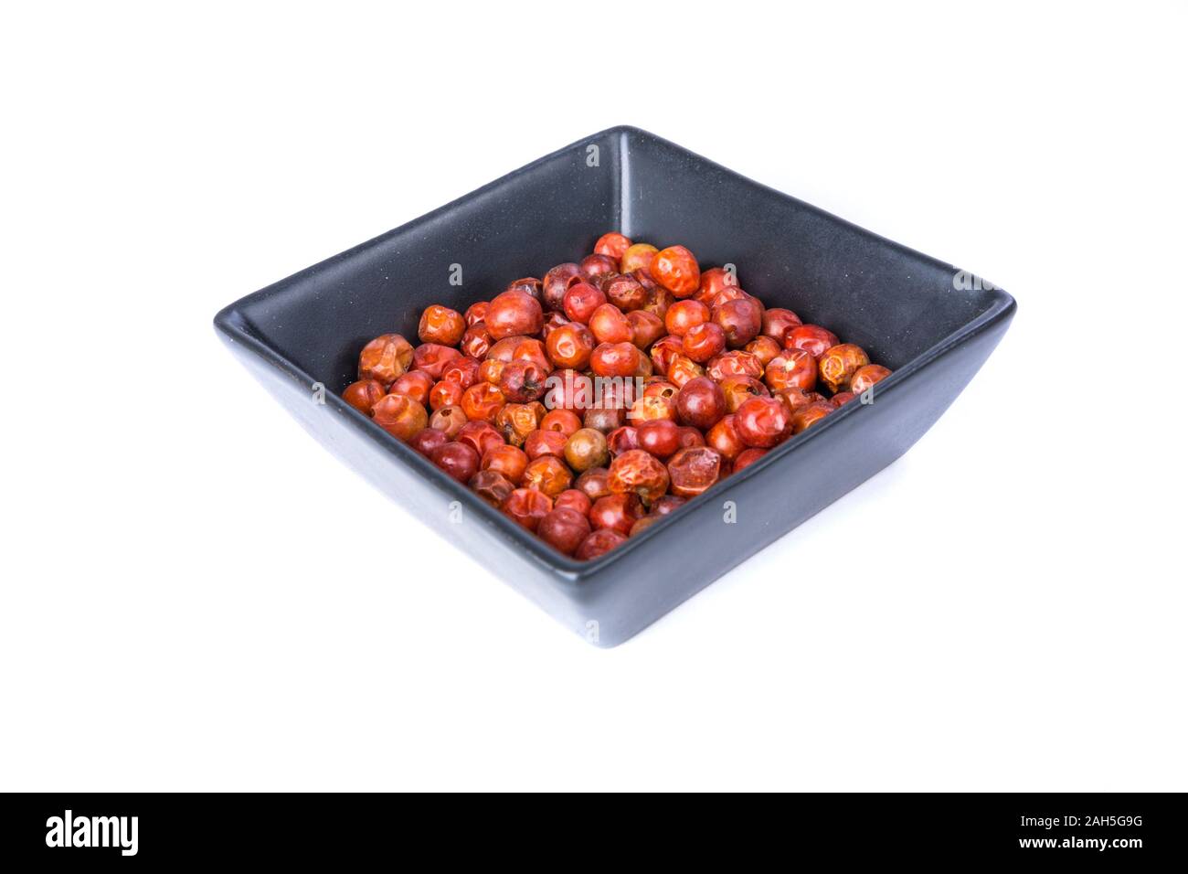 Handful of red spicy tiny round chile tepin peppers Stock Photo
