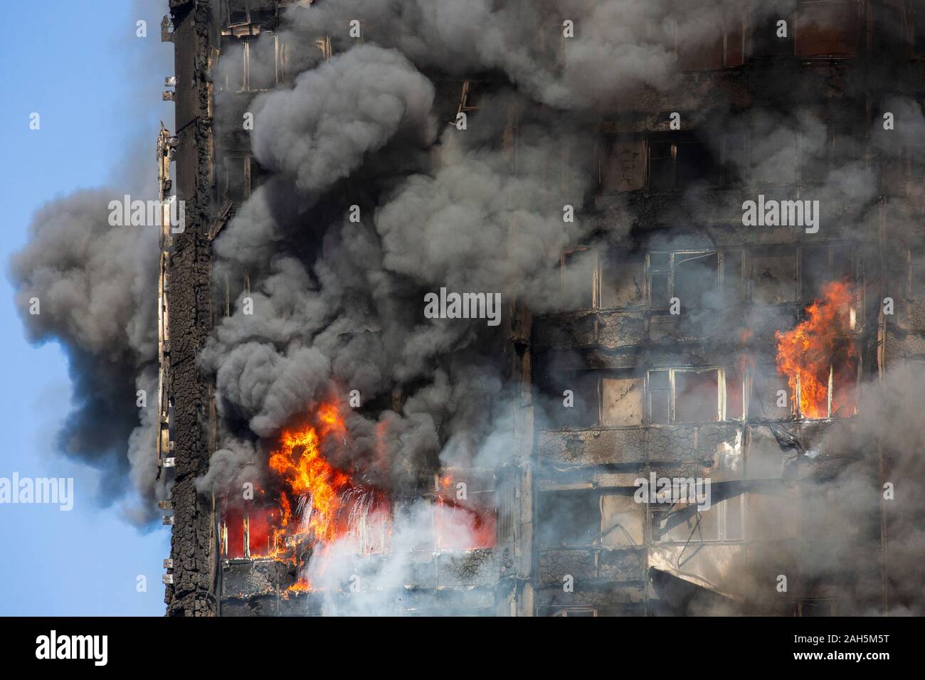 Grenfell Tower fire. Fire is still burning inside the tower at 9am. Stock Photo