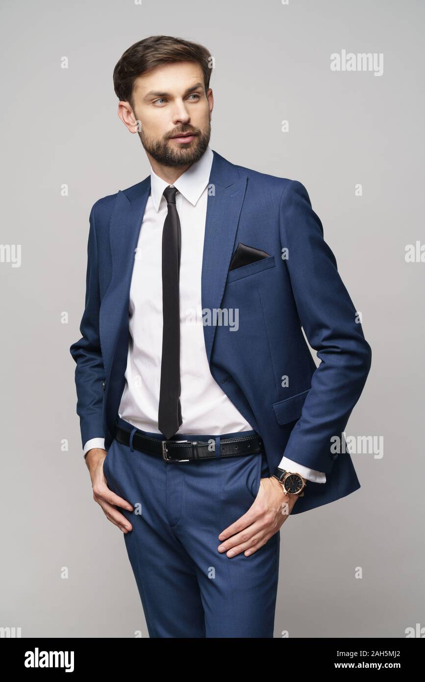 studio photo of young handsome businessman wearing suit Stock Photo - Alamy