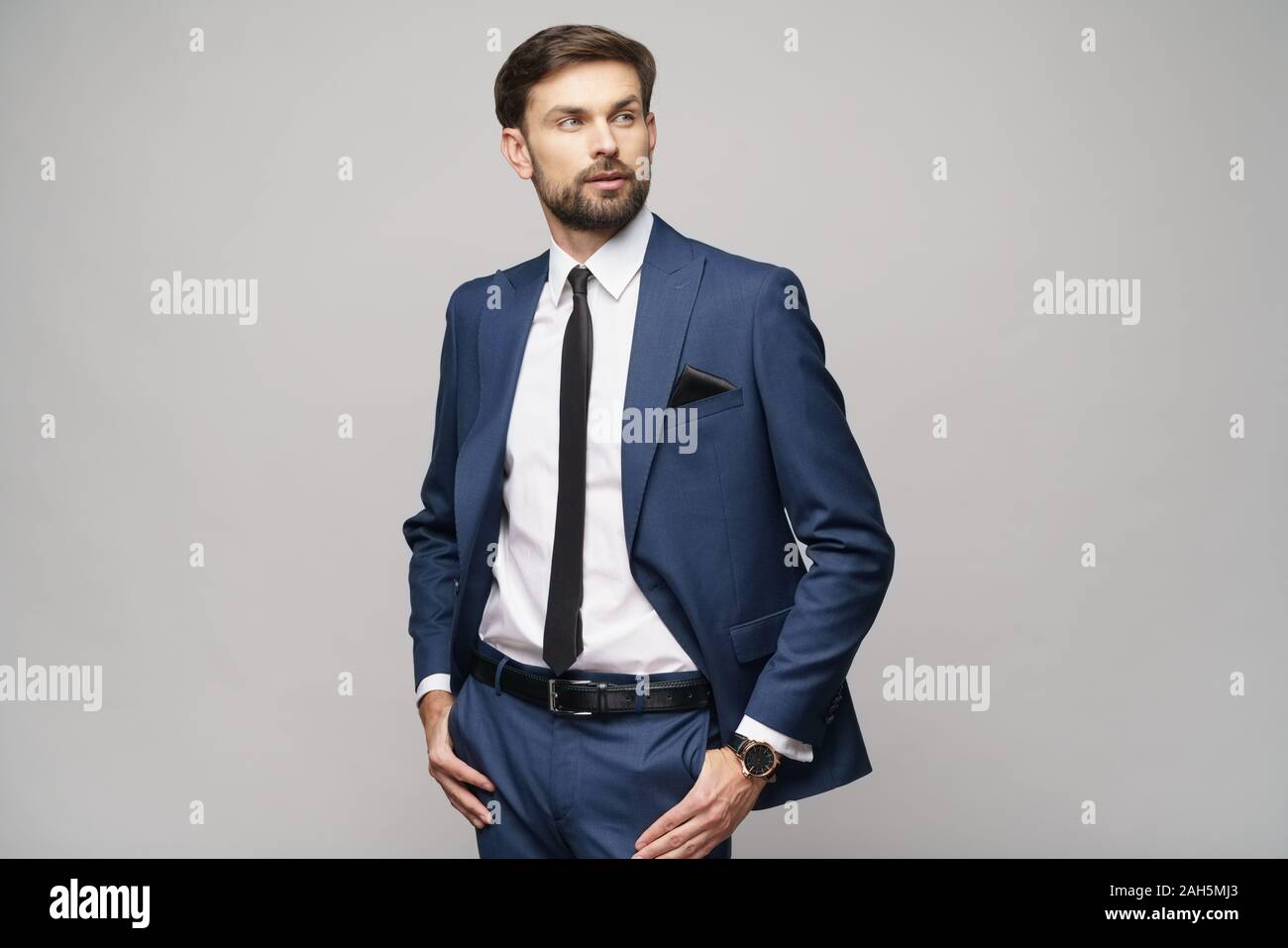 studio photo of young handsome businessman wearing suit Stock Photo - Alamy
