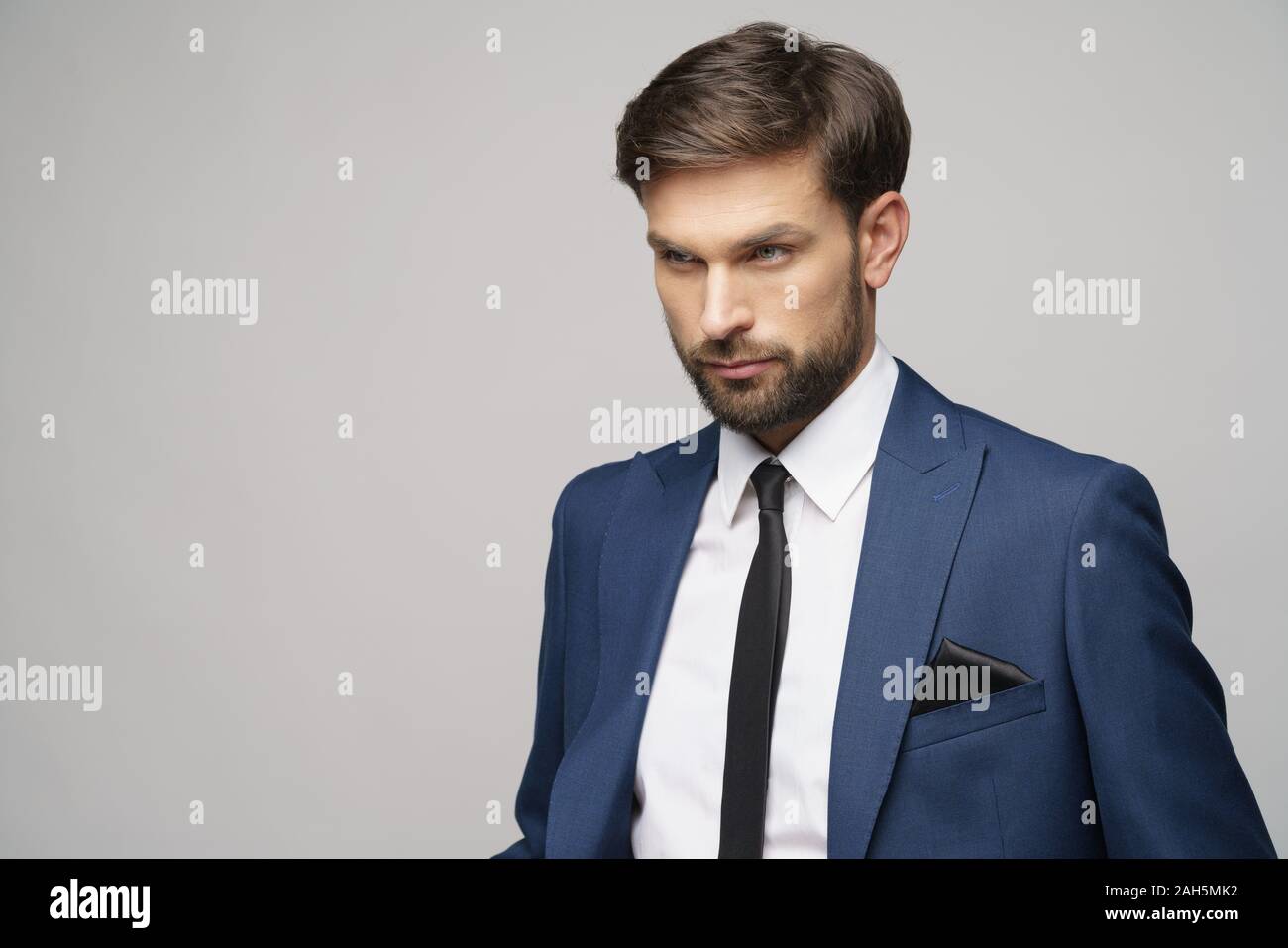 studio photo of young handsome businessman wearing suit Stock Photo - Alamy