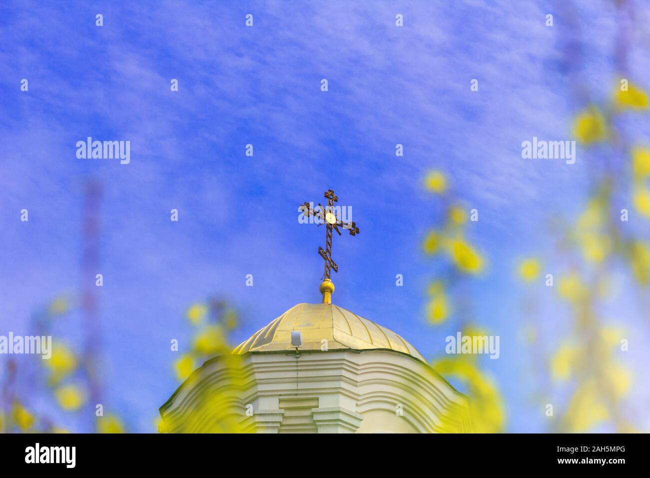Golden dome of the Orthodox church. In the spring sky Stock Photo