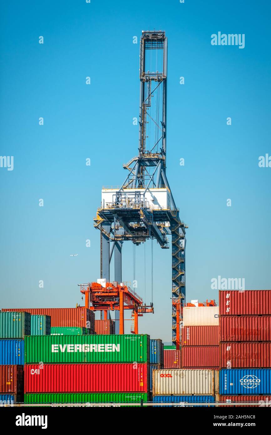 HongKong, China - November 2019: Cranes loading shipping container on freight harbour logistics centre in Hong Kong Stock Photo
