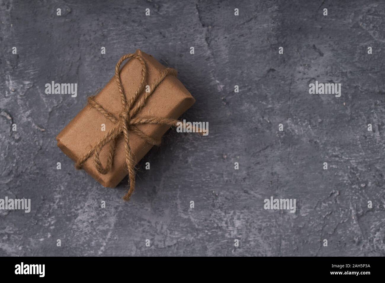 Gift boxes in craft paper on concrete background Stock Photo