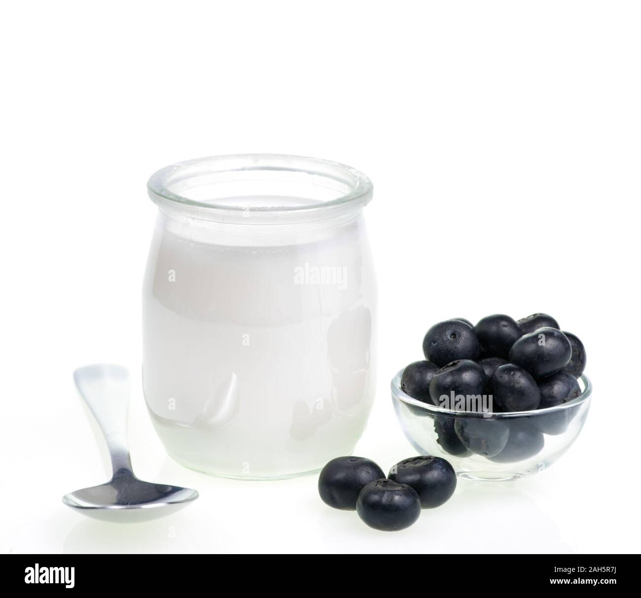 Old-fashioned yogurt jar and Blueberries on white background Stock Photo
