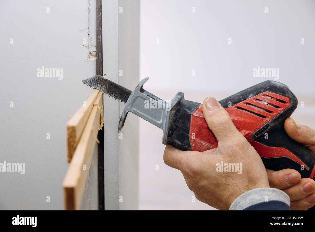 Installing a wooden beam cased opening walkway between rooms, closeup