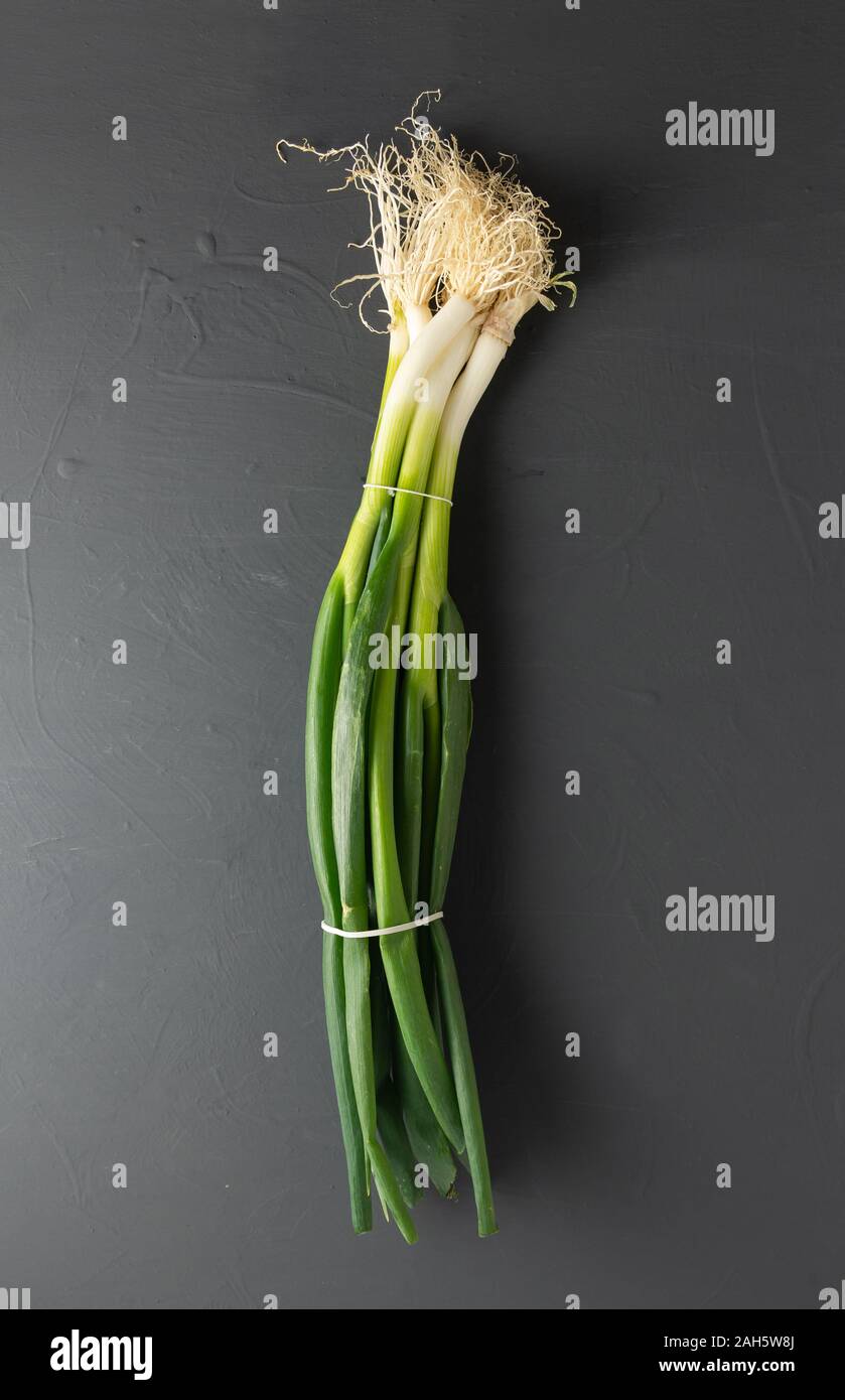 bunch of fresh young garlic on black background. isolated from the background Stock Photo