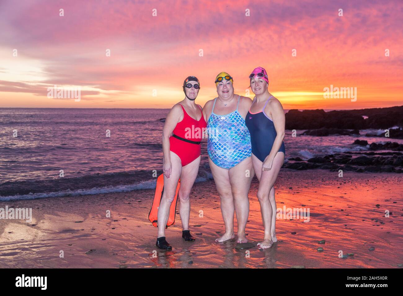 Myrtleville, Cork, Ireland. 25th December, 2019. Marie Watson, Carrigaline and Brenda Sisk from Tivoli preparing to go in for an early morning Christmas Day swim before dawn at Myrtleville, Co. Cork, Ireland.- Credit; David Creedon / Alamy Live News Stock Photo