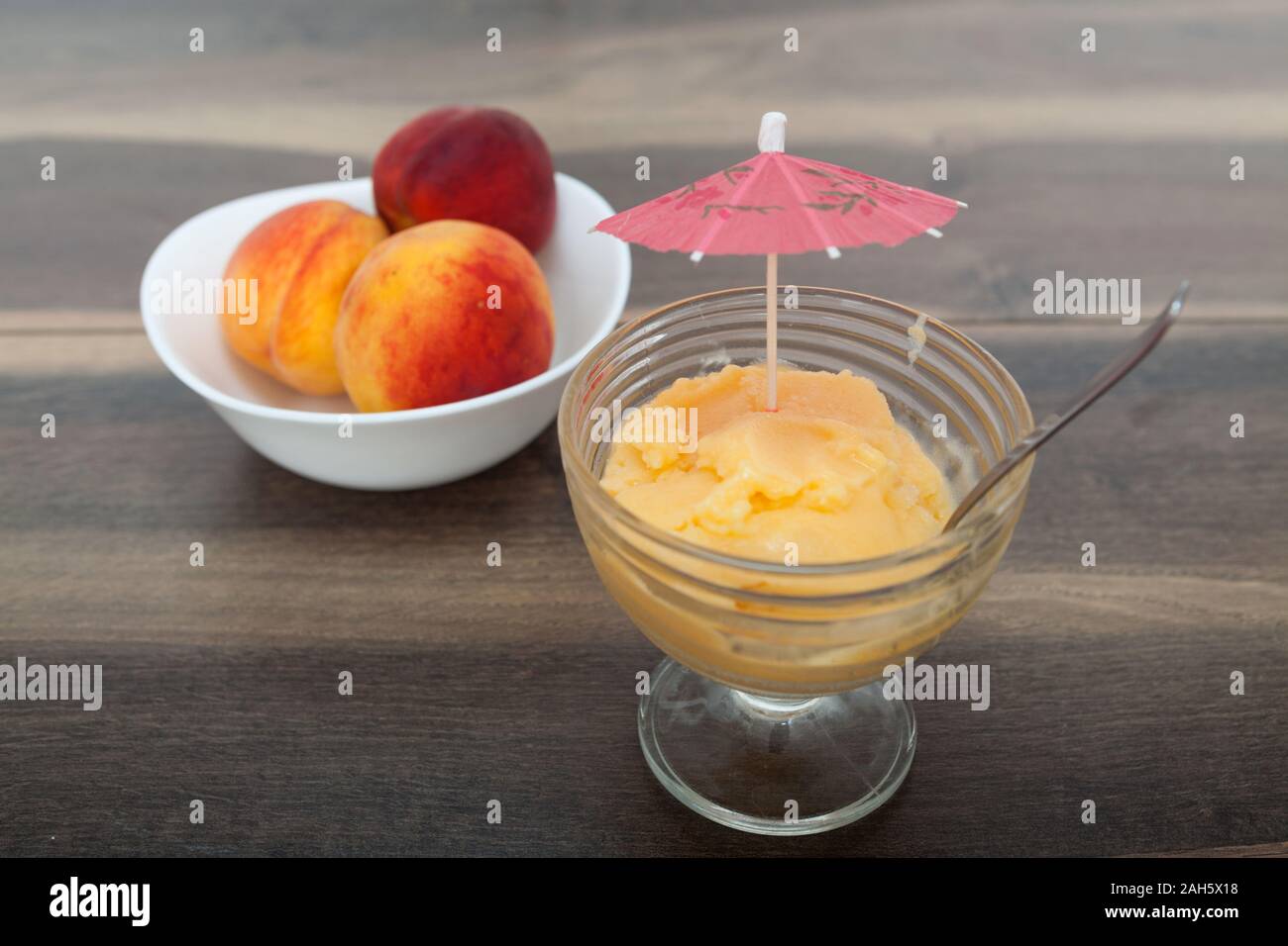 Frozen peach yogurt with with fresh fruits Stock Photo