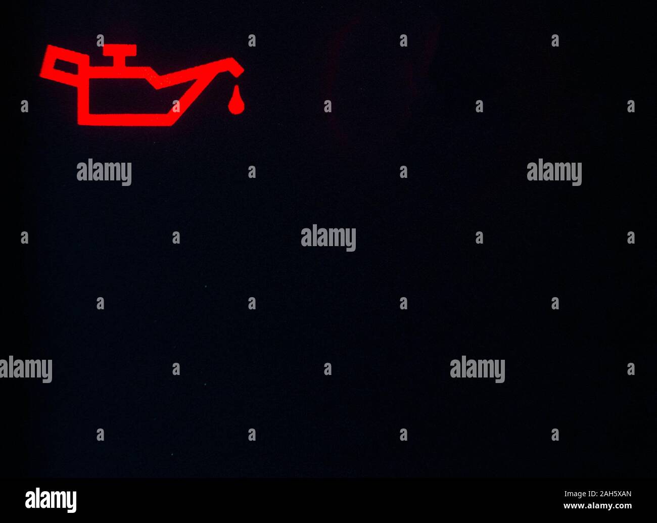 Red icon on the dashboard in the car engine oil pressure. Engine oil