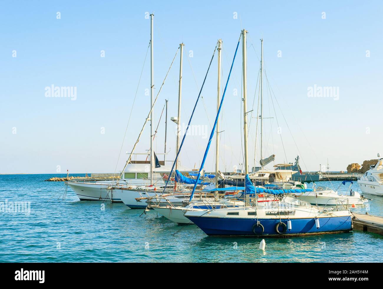 Yachts and motor boats in marina of Larnaca in sunny day, Cyprus Stock Photo