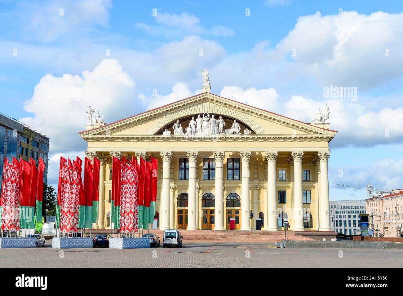 Labour Union Palace of Culture, waving national flags at central October Square, Minsk, Belarus Stock Photo